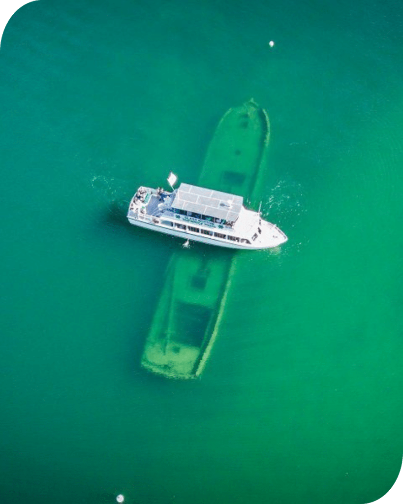 Cruise boat over top a shipwreck in Lake Superior